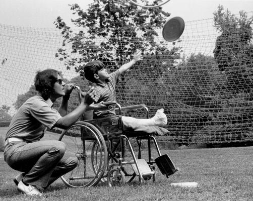 Cardinal Hill Hospital; Boy tosses Frisbee with friend