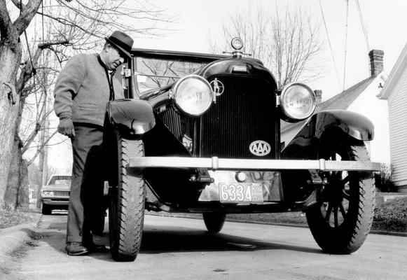 Cars and Other Vehicles; Car from #490 with owner inspecting