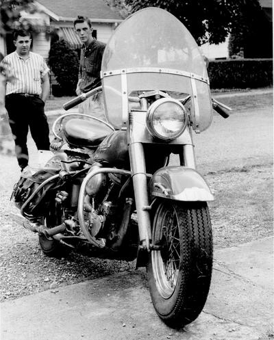 Cars and Other Vehicles; A motorcycle with a windshield and saddlebag