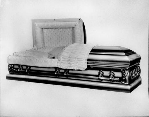 Caskets; Metallic casket with white lining