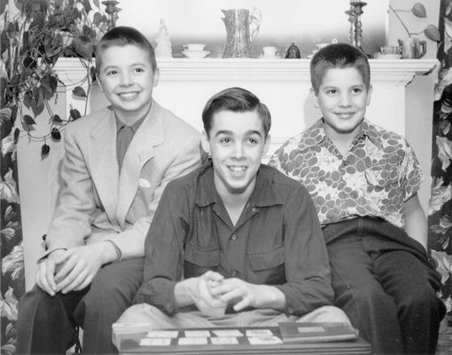 Children; Three boys posing with cards