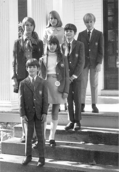 Children; Six school children with blazers on steps