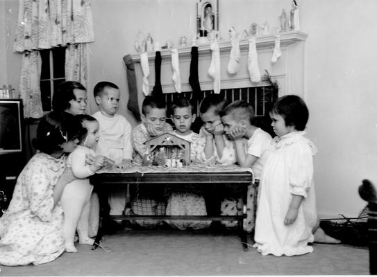 Children; Children look at nativity set before bedtime