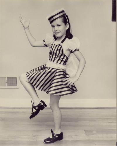 Children; In Costume; A young dancer waves for the camera