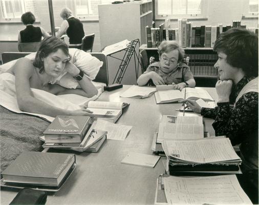 Children; In the Hospital; A reading teacher helps two kids in a hospital