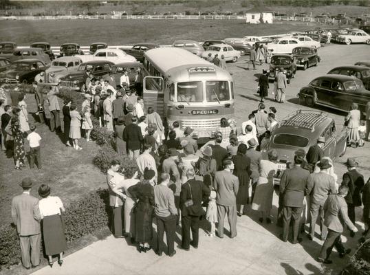 Crowd Scenes; Passengers board a chartered bus