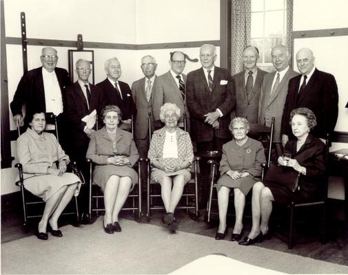 Groups; Unidentified; A group of senior citizens; four of whom sit in rocking chairs