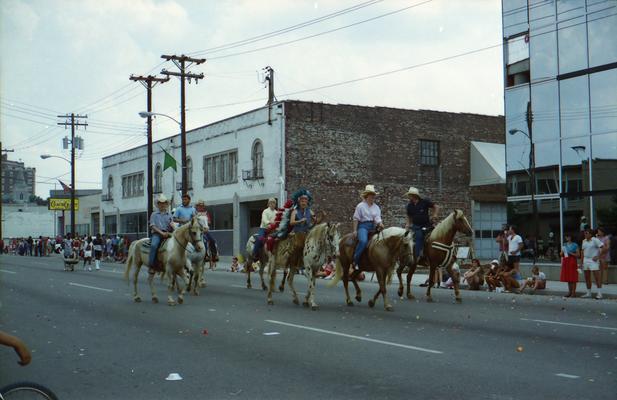 Group in western clothes on horseback at the Lexington Fourth of July parade