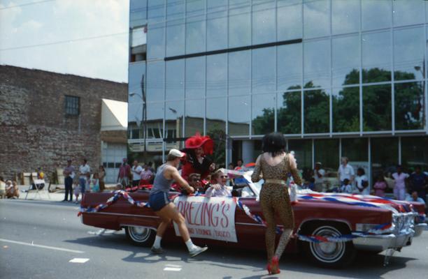 Brezing's Piano Lounge/Disco Cadillac car, some people in drag costume, near Elm Tree Lane