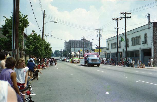 Eastern view of Main Street, parade trucks and parade watchers at the Lexington Fourth of July parade