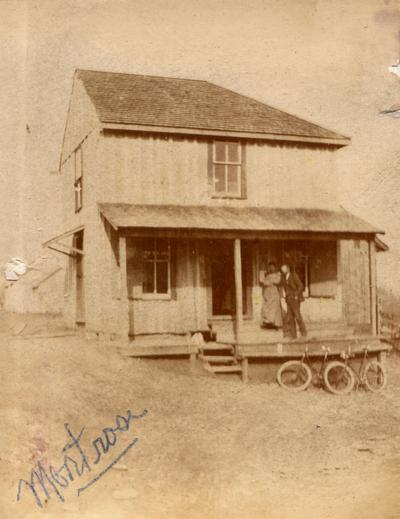 Benjamin Bronaugh and wife, Minnie Hughes Bronaugh, in front of their family grocery store in Montrose, Kentucky