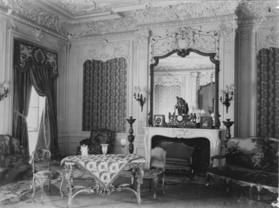 Drawing Room; Interior of Elmendorf Farm Mansion,  room has a dining room, a large mirror in center, chairs dot the room, a small table  sits near the center. Silver Print