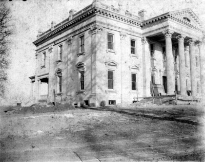 Exterior of building; Elmendorf Mansion, large, two-story house with tall columns on a portico.  