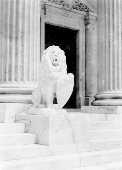 Stone lion at the entrance to a building. Silver Print