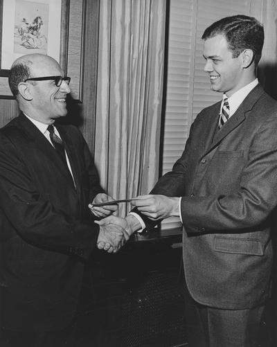 Albright, Arnold D., Executive Vice President for Institutional Planning, pictured with Jim Stratton, IBM Account Representative, Data Processing Division, Public Relations Department photograph