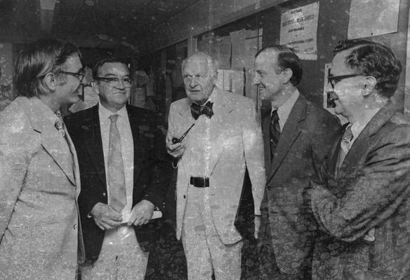 Conti, Samuel F., Professor, Microbiology, University Information Services, pictured (left) with Wendell C. DeMarcus, Lars Onager, Nobel Prize winner in Chemistry, and two unidentified individuals