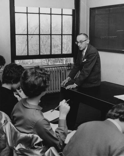 Cooke, Arthur Louis, Professor of Literature, English Department, pictured lecturing class