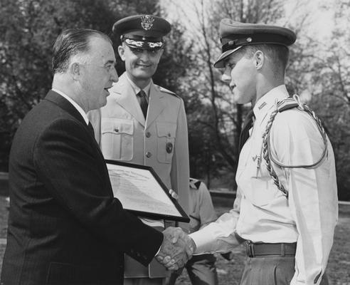 Craig, David C., Alumnus,, Air Reserve Officers Training Corps Cadet, pictured receiving certificate from Governor A. B. Chandler on UK ROTC Honors Day, also pictured is Colonel Roland W. Boughton, photographer: Lexington Herald Staff