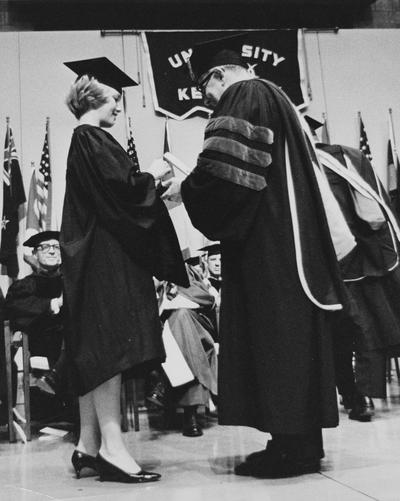 Cross, Johnnie, Alumna,, pictured at Commencement, receiving Sullivan Medallion