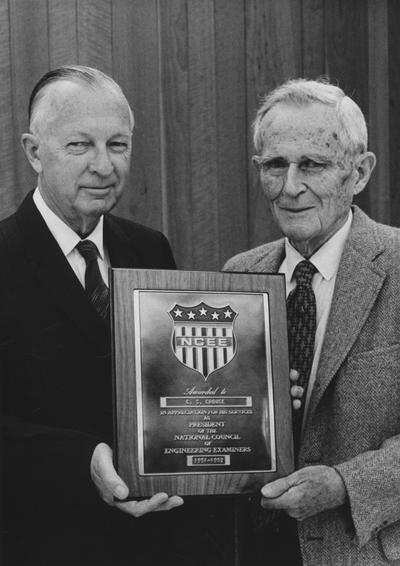 Crouse, Charles S., born 1888, died 1980, Professor and Chair, Department of Mining and Metallurgical Engineering born 1888, died 1980, pictured right receiving plaque from the National Council of Engineering Examiners representative Dwight W. Bray, a Frankfort engineer