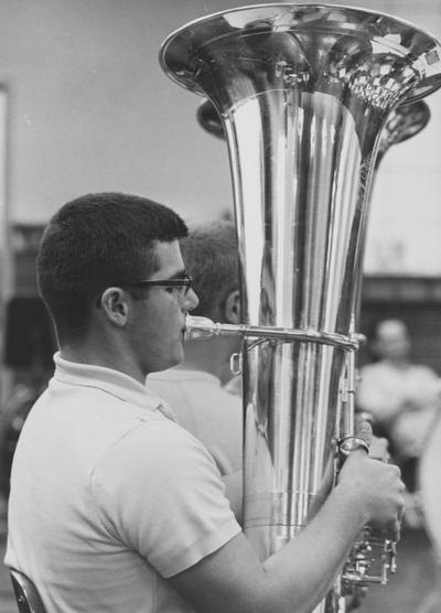 Davenport, Bob, Alumnus,, pictured playing the tuba during summer band camp, June 1966, Public Relations Department