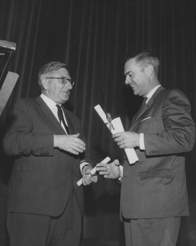 Dickey, Frank G., President, University of Kentucky, 1956 - 1963, Dean, College of Education, pictured (right) awarding the Kentucky Colonel commission to Sir Frank Francis, at the Guignol Theater, April 30, 1963