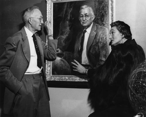 Downing, Harold Hardestry, born 1886, died 1967, Professor of Math and Astronomy 1910-1947, Head of Department of Mathematics 1947-1957, Head Tennis Coach, 1910 - [1960], pictured with Cecilia Steinberg and a portrait of Professor Downing