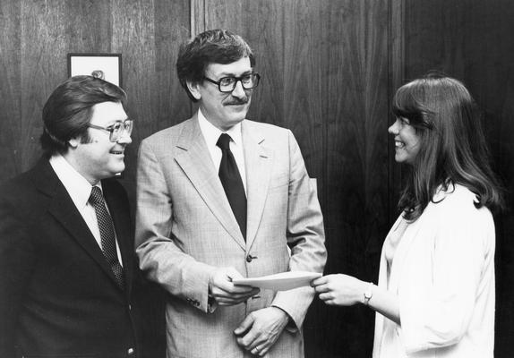 Eichhorn, Roger, Professor of Mechanical Engineering, Dean, College of Engineering, pictured (center) with two unidentified individuals