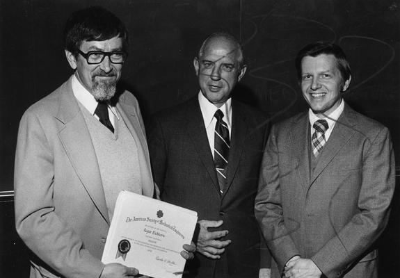 Eichhorn, Roger, Professor of Mechanical Engineering, Dean, College of Engineering, pictured (left) with two unidentified individuals