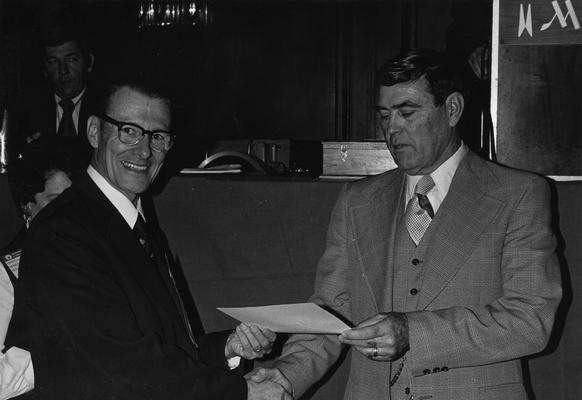 Fagan, Bernard Thomas, Professor, Industrial Education, Chair, Occupational Commission, pictured (left) with Dr. Joe Mills, retiring chairman of the Occupational Commission