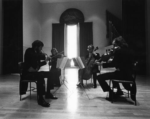 Farrar, Rodney, Professor of Cello, Member of the Concord Trio, a faculty ensemble, pictured here playing as a member of the LaMay Quartet along with Brice, Cathy and Ned Farrar