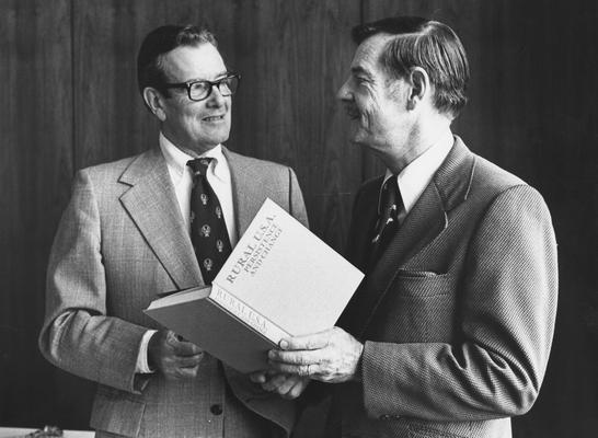 Ford, Thomas Robert, Director, Center for Developmental Change and Professor of Sociology, pictured (right) presenting a book edited by Ford to United States Representative John B. Breckinridge at an occasion honoring Breckinridge by the Rural Sociological Society, December 4, 1978, University Information Services