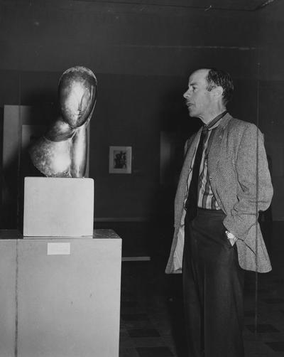 Freeman, Richard B., Professor, Art Department, pictured during an exhibit, December 1, 1958, Public Relations Department