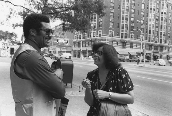 Hanley, Alvin, C., Director of Minority and Disadvantaged Recruitment, chats with a woman in downtown Louisville