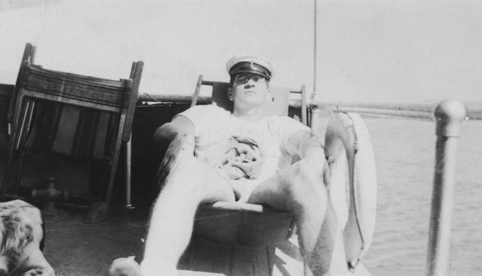 Kirwan, Albert, University of Kentucky President from 1968-1969, napping on a sunny boat deck