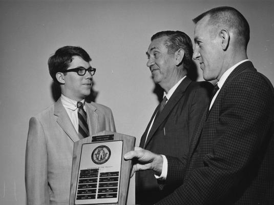 Barrickman, John R., receives the Annual Wall Street Journal Student Achievement Award, pictured with Professor Herman A. Ellis and Clyde L. Irwin, Associate Dean of College of Business and Economics