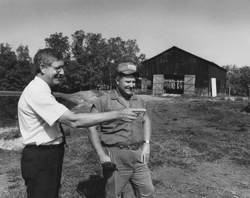 Mackey, Ray, University of Kentucky Public Relations Promotional, Mackey on tobacco farm talking with man
