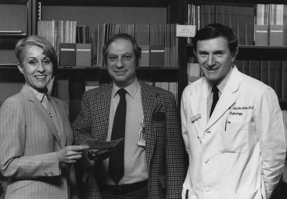 Markesbery, William R., Director of Sanders Brown Research on Aging, from left to right, Wendland, Wekstein, and Markesbery