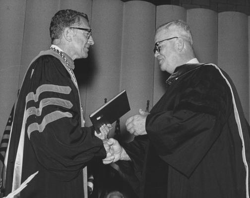 Moser, John August, pictured receiving Honorary Degree from Dr. Singletary