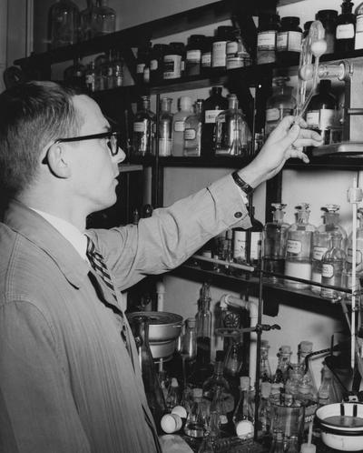 Nierson, Arnold Thor, Assistant Professor in Chemistry, pictured in his lab studying reactions resulting from a type of atomic transfer under a grant from the Petroleum Research Fund of the American Chemical Sociey, from Public Relations Department