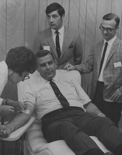 Ray, John, University of Kentucky football coach, pictured getting a physical examination