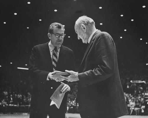 Rupp, Adolph, University of Kentucky Basketball Coach 1930-1971, pictured receiving award