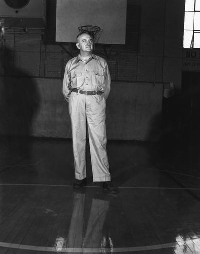 Rupp, Adolph, University of Kentucky Basketball Coach 1930-1971, pictured in practice clothes in Alumni Gym