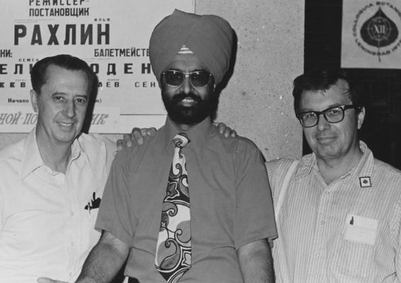 Sabharwal, Pritman S., Professor of Biology, pausing before a Russian language sign are University of Kentucky faculty members who presented papers at the XII International Botantical Congress held in 1976 Leningrad, USSR, pictured from left, Dr. Harry Wheeler, Plant Pathology; Dr. Pritman Sabharwal, Biological Sciences; and Dr. Joseph Kuc, Plant Pathology