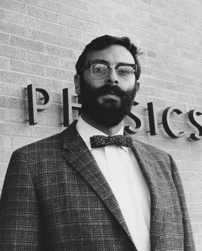 Weil, Jesse L., Professor of Physics, pictured in front of Physics Building
