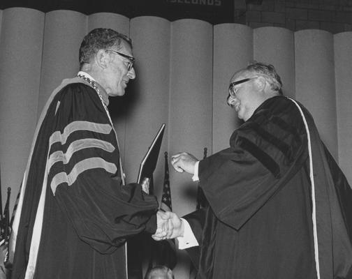 Widener, Peter A. B., pictured receiving Honorary Degree from Dr. Otis Singletary, from University Information Services