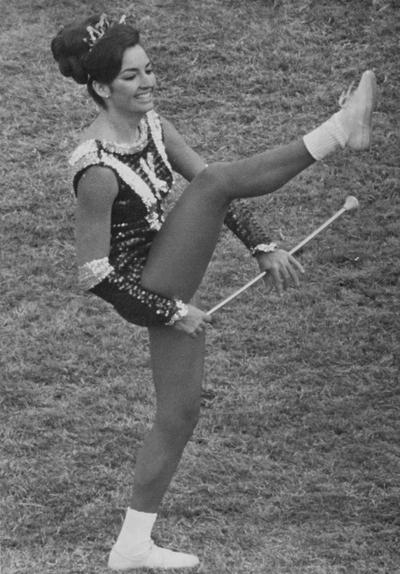 Windish, Joan, University of Kentucky Majorette, pictured in uniform with baton