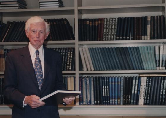 Young, William T. Sr., he was a member of the Board of Trustees, Pictured at the dedication of the William T. Young Library, Young is a philanthropist, businessman, and owner of Overbrook Horse Farm, Instrumental in book endowment and building of William T. Young Library, pictured standing in front of bookcase