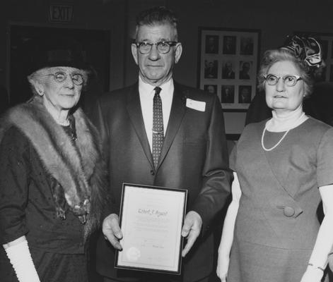 Bryant, Robert J., pictured with two unidentified women