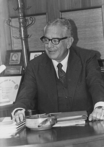 Singletary, Otis A., President of the University of Kentucky 1969-1987, pictured seated at his desk, Photographer: Chuck Perry